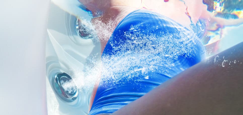 Foot blasters at the base of the hot tub